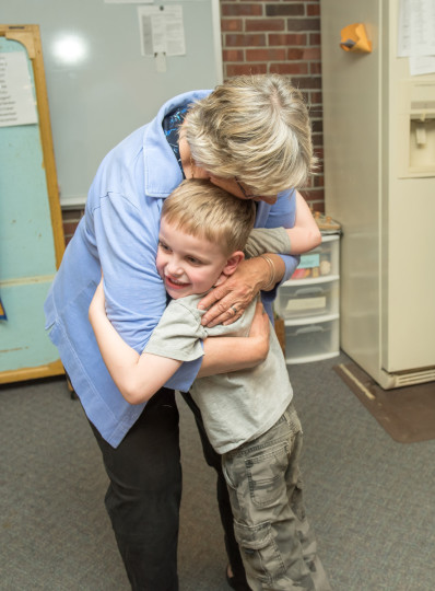 MaryAnn student hug