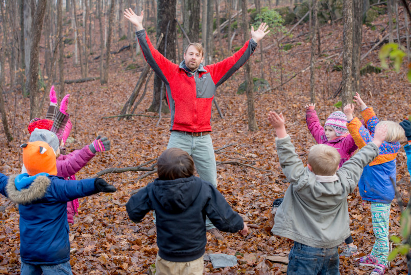 Josh Martin in forest with students