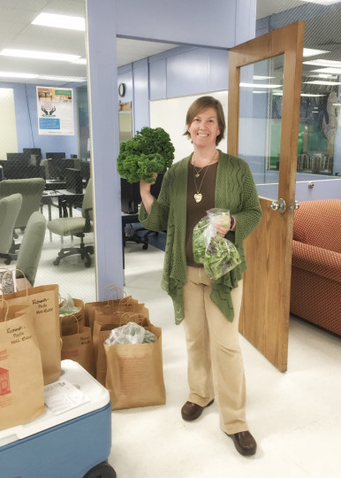 Karen McCalla distributing veggies 