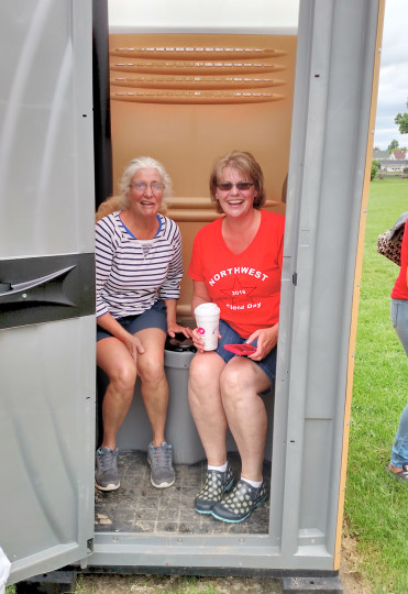 Faith cleaning outhouse