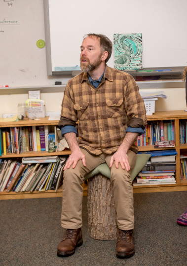 andrew sitting on stump