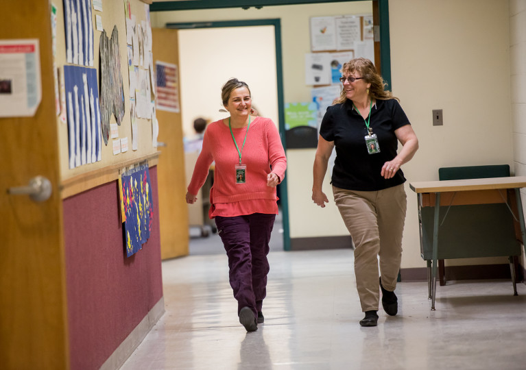 penny and Tracy indoors walking